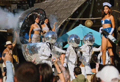 Disco-ball performers mid-show at Finns Beach Club