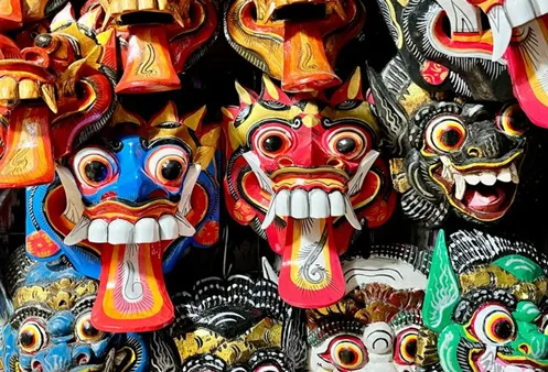 Hand-carved Balinese masks at a Kuta market