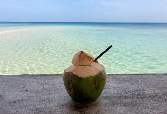 A fresh coconut on the sand, Nusa Penida